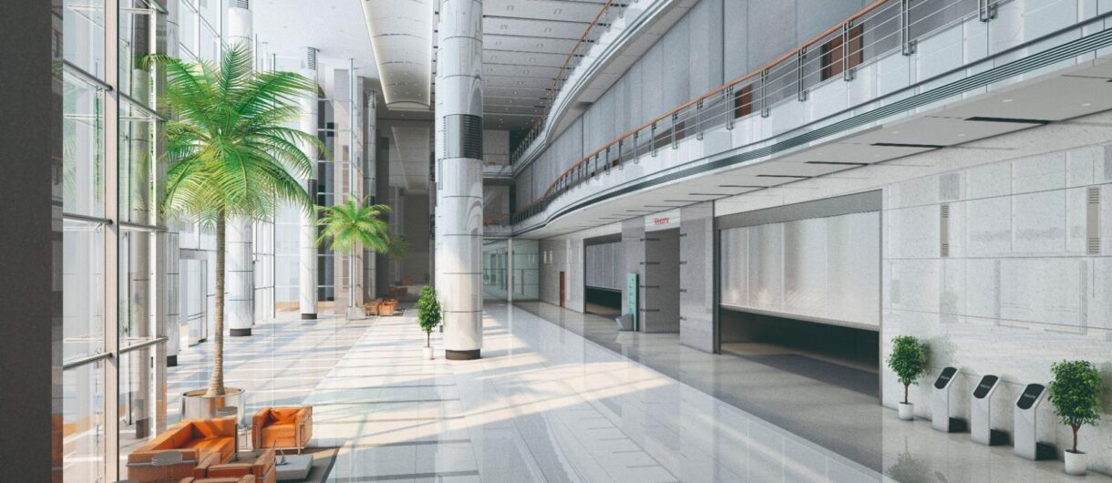 Modern building lobby designed with integrated fire and smoke curtain systems requiring certified performance testing